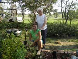 Cheyenne & Grandmother working in the flower beds.