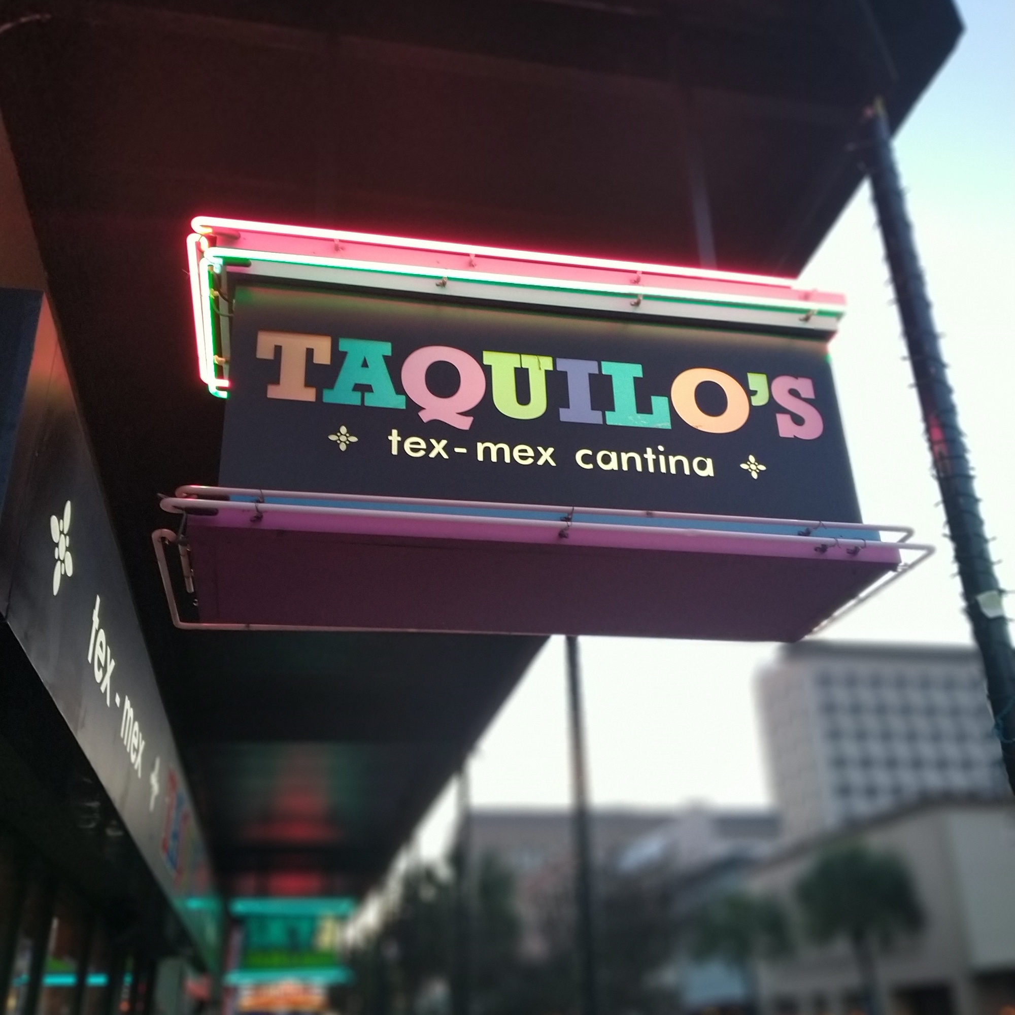 Neon-sign-for-taquillos-texmex-cantina-in-galveston-texas-at-sunset